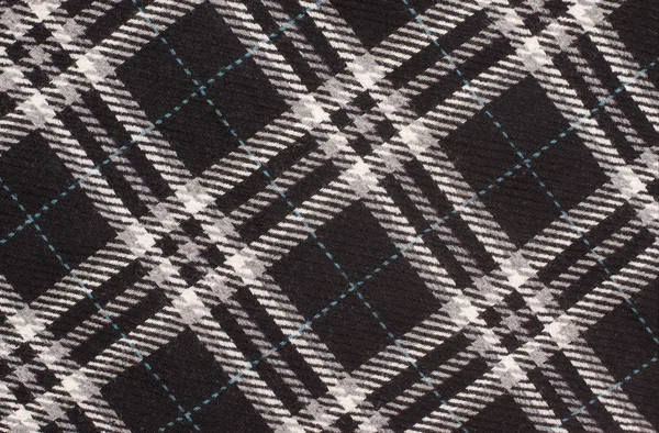 Black and white with blue plaid print as background. — Stock Photo, Image