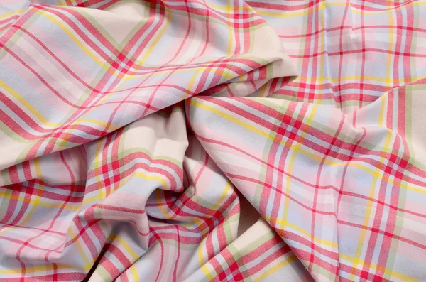 Pink tartan pattern on crumpled fabric. Colored lines and square — Stock Photo, Image