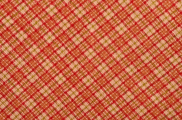 Oranje met witte plaid gedrukt als achtergrond. Schotse tartan patroon. — Stockfoto