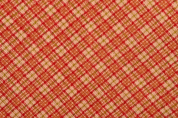 Arancione con stampa a quadri bianca come sfondo. Modello scozzese tartan . — Foto Stock