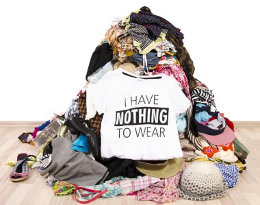 Big pile of clothes thrown on the ground with a t-shirt saying nothing to wear. clipart