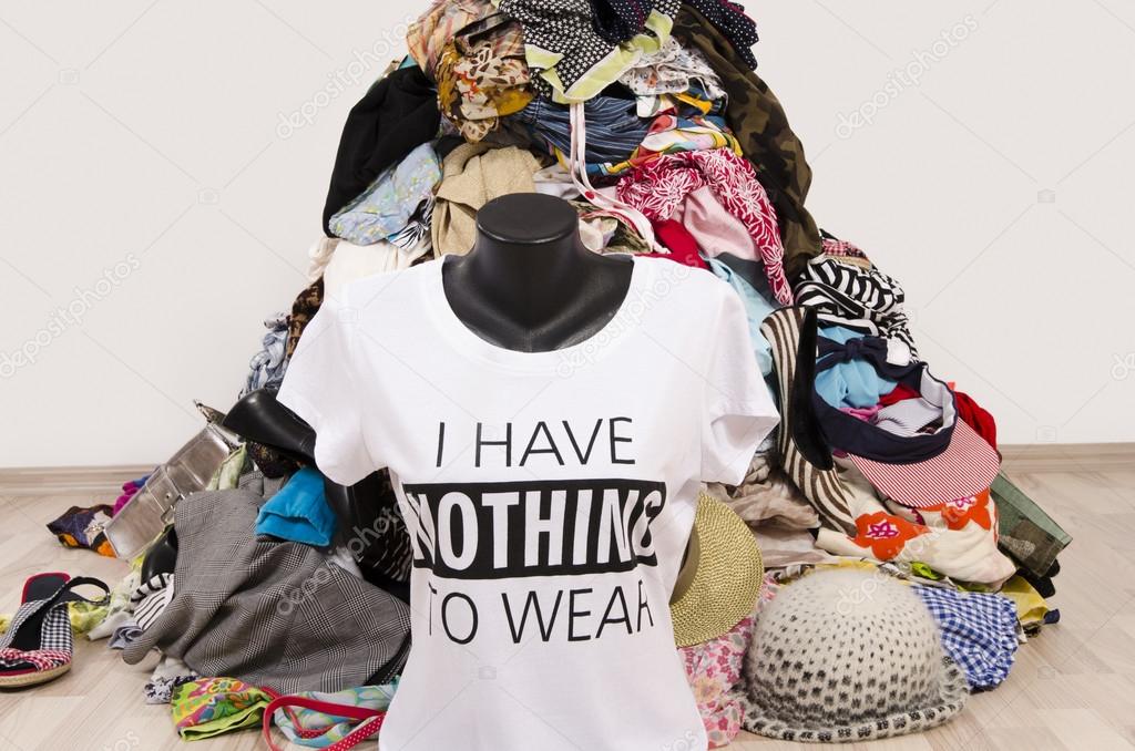 Big pile of clothes thrown on the ground with a t-shirt saying nothing ...