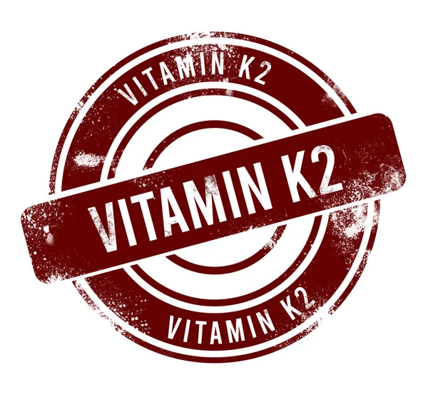 K2 vitamini - kırmızı yuvarlak grunge tuşu, damga