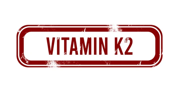 K2 vitamini - kırmızı grunge tuşu, damga