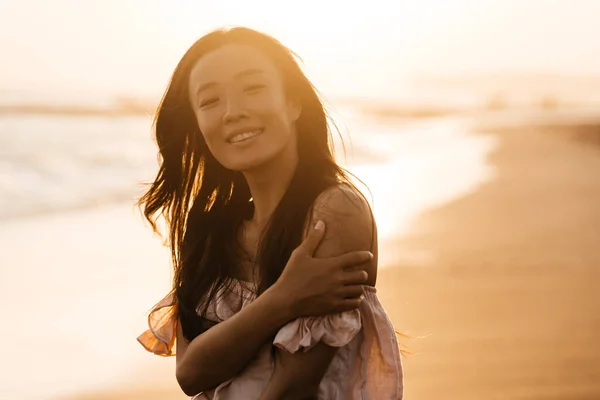 Smile Freedom and happiness chinese woman on beach.