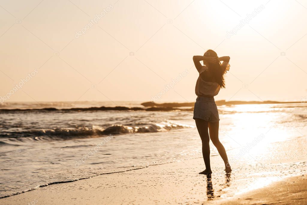 Smile Freedom and happiness chinese woman on beach.