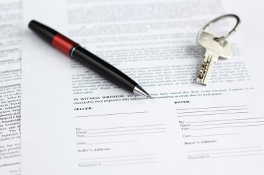 Legal document for sale of real estate with pen and house keys clipart