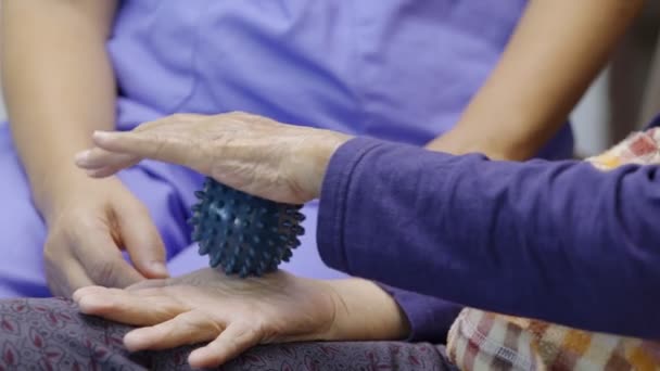 Elderly Woman Doing Rubber Ball Exercise Fingers Palm Hand Foot — Stock Video