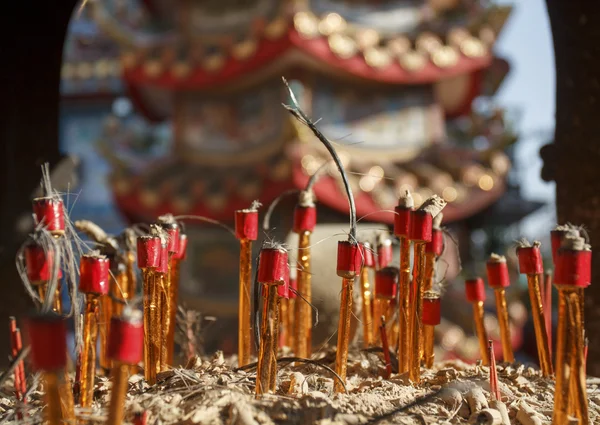 Chinese ritual candles after ceremony in temple. — Stock Photo, Image