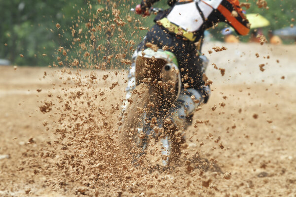 Mud debris flying from a motocross race