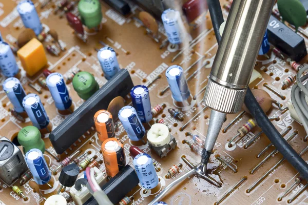 Soldering iron and repair electronic circuits — Stock Photo, Image