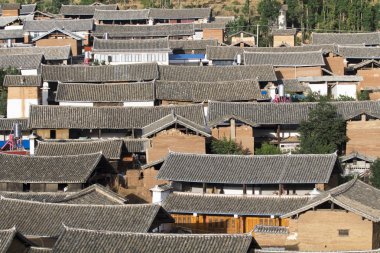 Chinese traditional roofs in rural , Yunnan China clipart