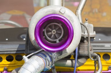 Turbo charger on race car engine clipart