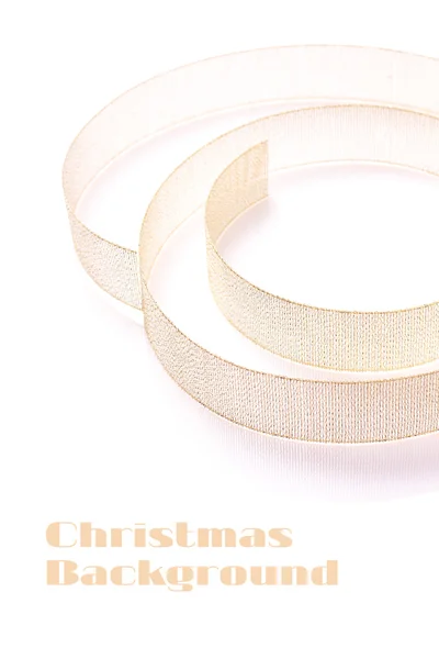 Christmas decoration background. Golden twisted ribbon isolated on white background — Stock Photo, Image