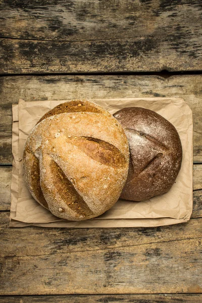 Two loaf of bread on paper bag — Stock Photo, Image