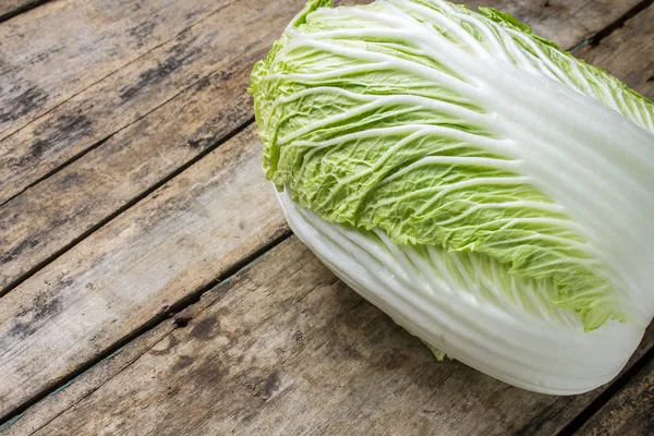 Fresh green cabbage on wooden table — Stock Photo, Image