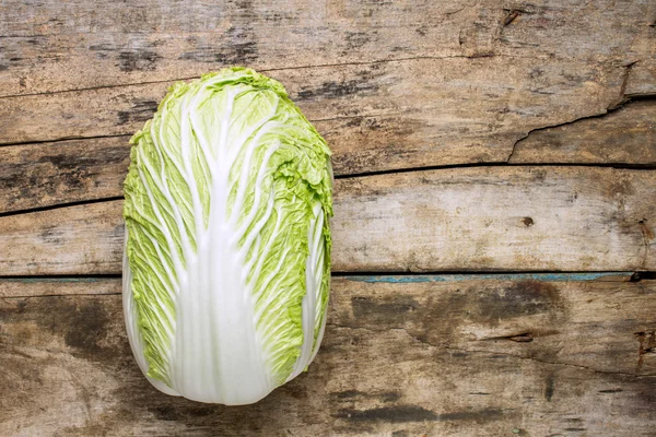 Fresh chinese cabbage on wooden background — Stock Photo, Image