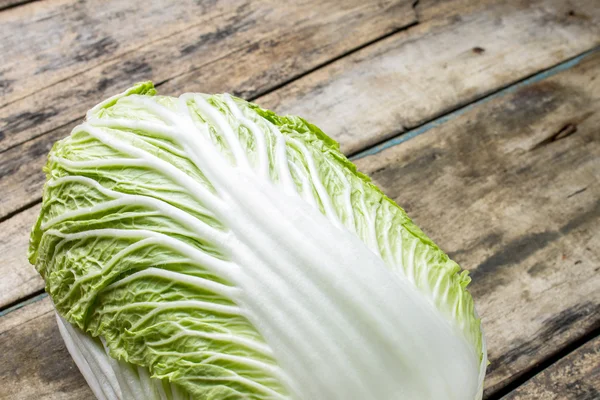 Fresh green cabbage on wooden table — Stock Photo, Image