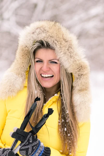 Blonde young smiling woman with ski at winter time Stock Image