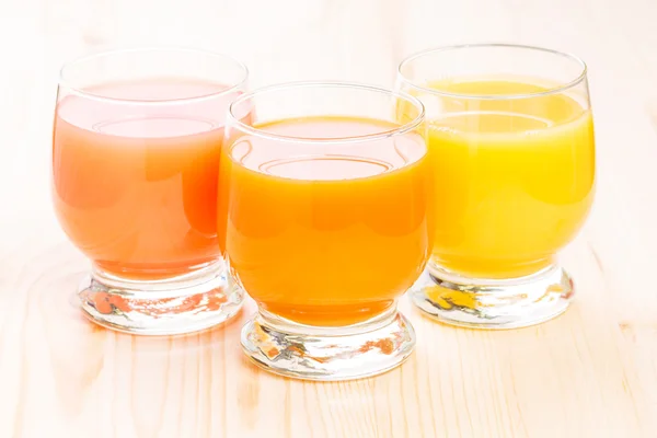 Three glasses of fresh natural juice. — Stock Photo, Image