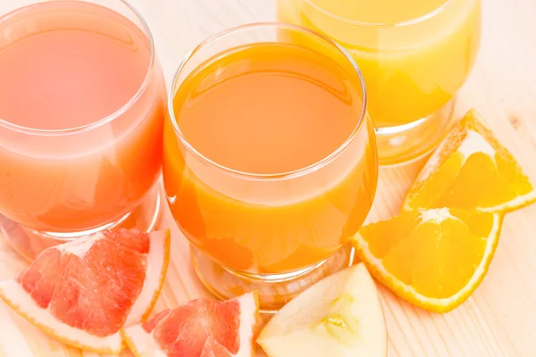 Fresh juice with different pieces of fruits. — Stock Photo, Image