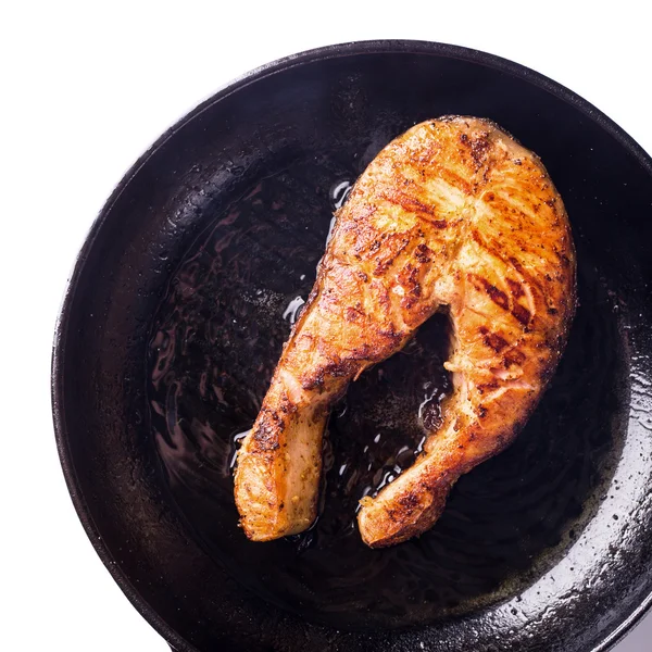 Roasted salmon steak on grill pan on white — Stock Photo, Image