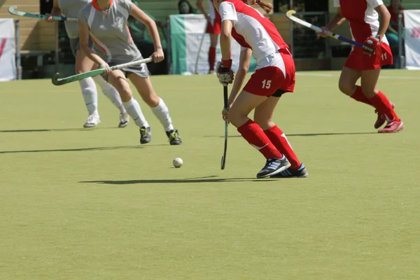 Women field hockey players with ball — Stock Photo, Image