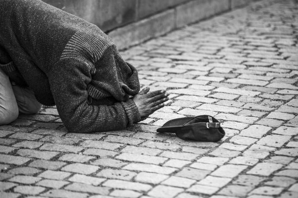  man begging for money, black and white