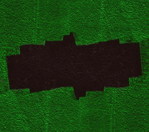 Zelená stěna s černou dírou — Stock fotografie