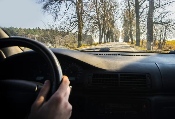 Driving a car in the village — Stock Photo, Image