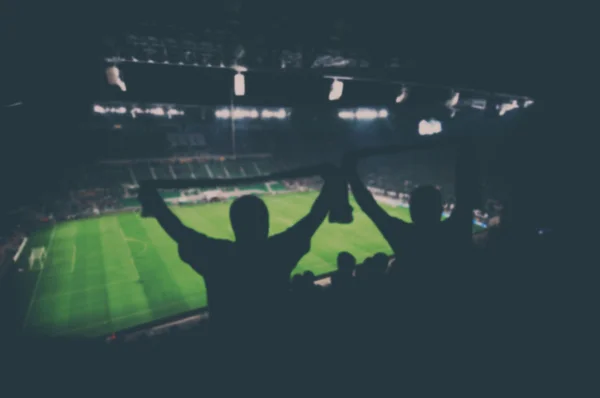 Fãs desfocados no estádio de futebol, efeito vintage — Fotografia de Stock