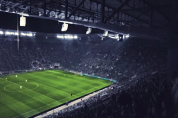 Blurred football stadium — Stock Photo, Image