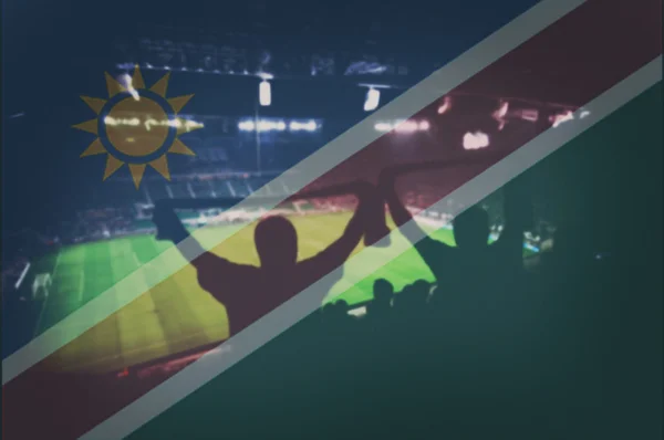 Estadio deportivo con aficionados y mezcla de bandera de Namibia — Foto de Stock