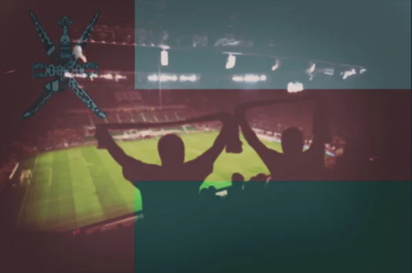 Stadion med fans och blandning Oman flagga — Stockfoto