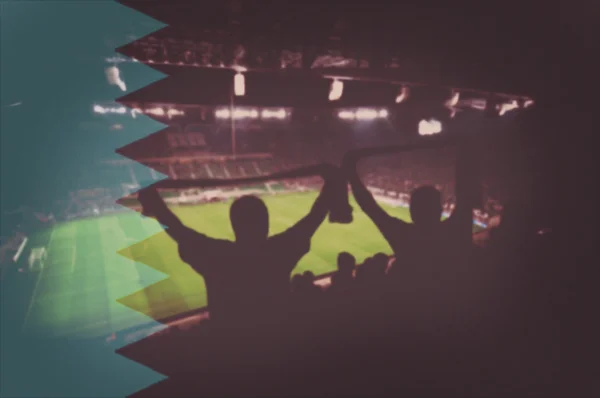 Stadion med fans och blandning Behrain flagga — Stockfoto