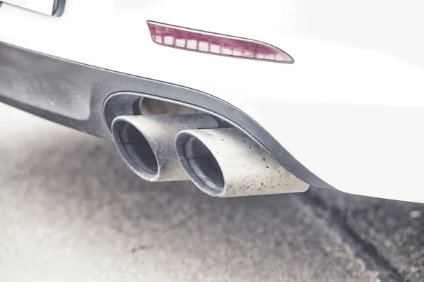 Double exhaust pipes of a modern sports car, — Stock Photo, Image
