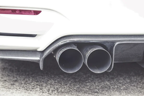Double exhaust pipes of a modern sports car — Stock Photo, Image