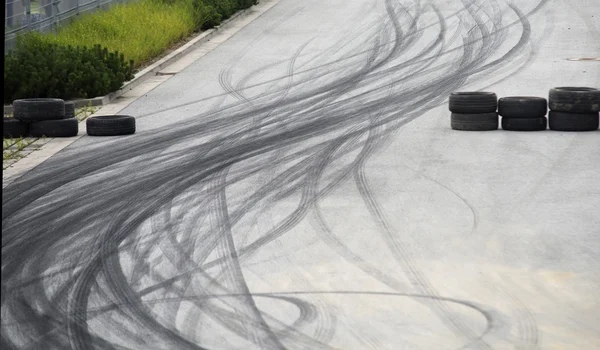 Tyre burnout marks on asphalt road — Stock Photo, Image