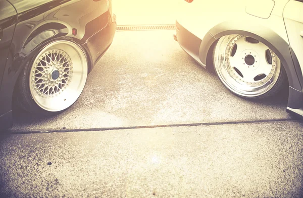 Background of tuning cars on street, vintage effect — Stock Photo, Image