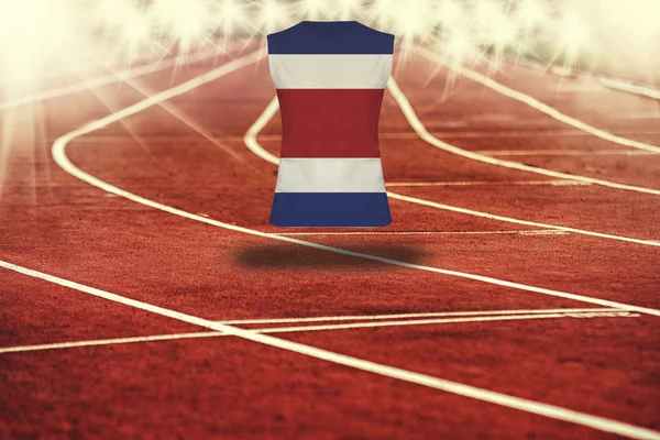 Red running track with lines and Costa Rica flag on shirt — Stock Photo, Image
