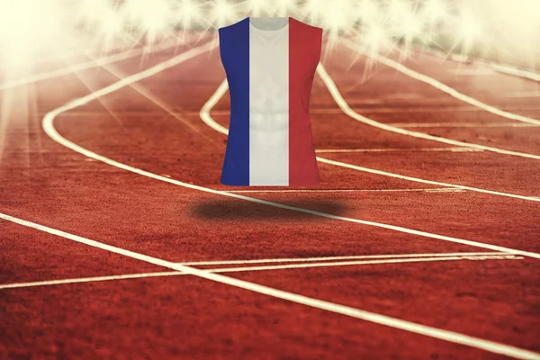 Red running track with lines and France flag on shirt — Stock Photo, Image
