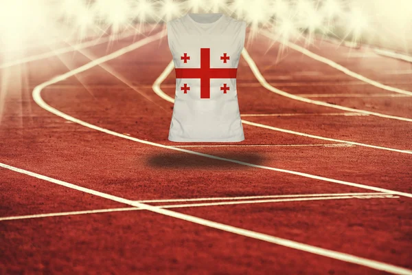 Pista de atletismo roja con líneas y bandera de Georgia en camisa —  Fotos de Stock