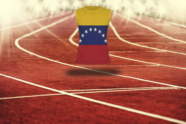 Red running track with lines and Venezuela flag on shirt — Stock Photo, Image