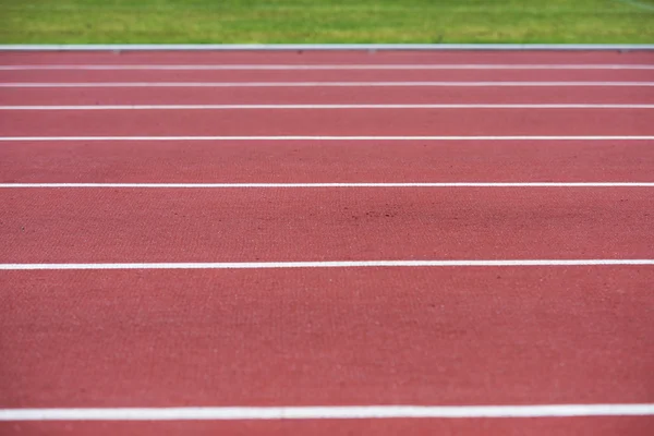 Close up on running track, athletic bacground — Stock Photo, Image