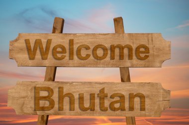 Bhutan hoş geldiniz şarkı üzerinde ahşap arka plan 