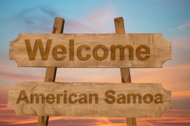 Amerikan Samoası şarkı ahşap arka plan üzerinde hoş geldiniz