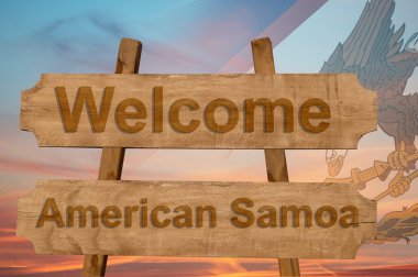Amerikan Samoası şarkı ulusal bayrak harmanlama ile ahşap arka plan üzerinde hoş geldiniz