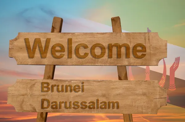Willkommen zu Brunei Darussalam singen auf Holz Hintergrund mit Blending Nationalflagge — Stockfoto