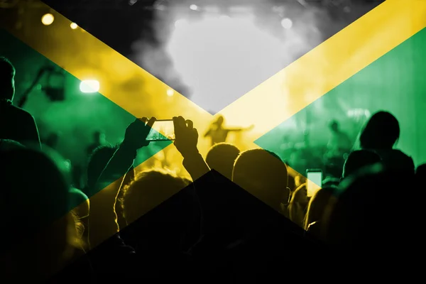 reggae live music concert with blending Jamaica flag on fans