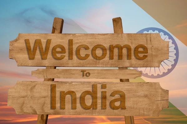 Welcome to India sing on wood background with blending national flag — Stock Photo, Image